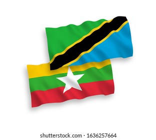 National vector fabric wave flags of Tanzania and Myanmar isolated on white background. 1 to 2 proportion.