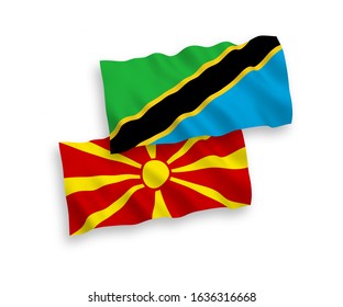 National vector fabric wave flags of Tanzania and North Macedonia isolated on white background. 1 to 2 proportion.