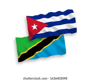 National vector fabric wave flags of Tanzania and Cuba isolated on white background. 1 to 2 proportion.
