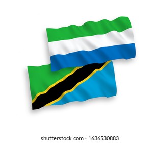 National vector fabric wave flags of Tanzania and Sierra Leone isolated on white background. 1 to 2 proportion.