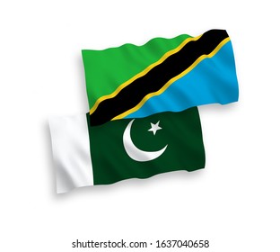 National vector fabric wave flags of Tanzania and Pakistan isolated on white background. 1 to 2 proportion.