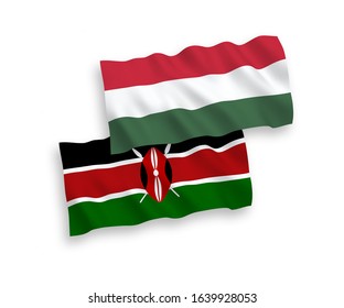 National vector fabric wave flags of Kenya and Hungary isolated on white background. 1 to 2 proportion.