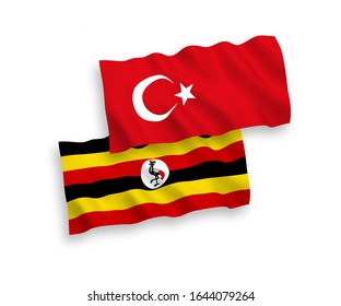 National vector fabric wave flags of Turkey and Uganda isolated on white background. 1 to 2 proportion.