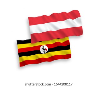 National vector fabric wave flags of Austria and Uganda isolated on white background. 1 to 2 proportion.