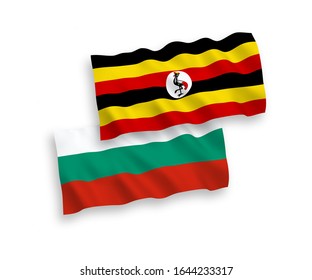 National vector fabric wave flags of Bulgaria and Uganda isolated on white background. 1 to 2 proportion.