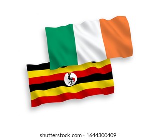 Banderas de olas de tela vectorial nacional de Irlanda y Uganda aisladas en fondo blanco. 1 a 2 proporciones.