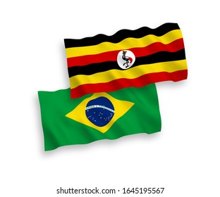 National vector fabric wave flags of Brazil and Uganda isolated on white background. 1 to 2 proportion.