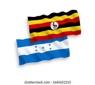 Banderas nacionales de tejido vectorial de Uganda y Honduras aisladas en fondo blanco. 1 a 2 proporciones.