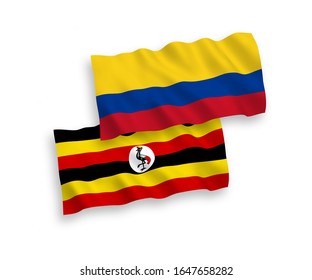 National vector fabric wave flags of Uganda and Colombia isolated on white background. 1 to 2 proportion.