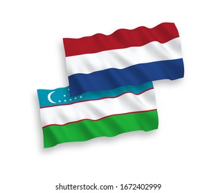 National vector fabric wave flags of Uzbekistan and Netherlands isolated on white background. 1 to 2 proportion.