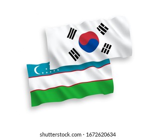 National vector fabric wave flags of South Korea and Uzbekistan isolated on white background. 1 to 2 proportion.