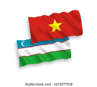Banderas de tela vectorial nacional ondean banderas de Uzbekistán y Vietnam aisladas en fondo blanco. 1 a 2 proporciones.