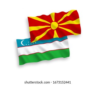 National vector fabric wave flags of Uzbekistan and North Macedonia isolated on white background. 1 to 2 proportion.