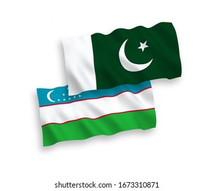 National vector fabric wave flags of Uzbekistan and Pakistan isolated on white background. 1 to 2 proportion.