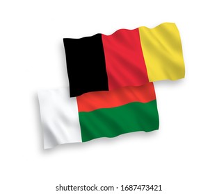 National vector fabric wave flags of Madagascar and Belgium isolated on white background. 1 to 2 proportion.