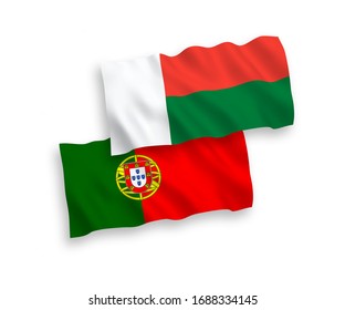 National vector fabric wave flags of Portugal and Madagascar isolated on white background. 1 to 2 proportion.