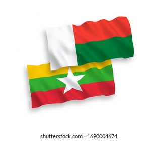 National vector fabric wave flags of Madagascar and Myanmar isolated on white background. 1 to 2 proportion.