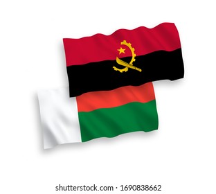 National vector fabric wave flags of Madagascar and Angola isolated on white background. 1 to 2 proportion.