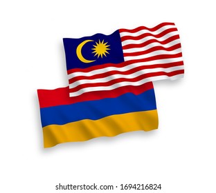 National vector fabric wave flags of Armenia and Malaysia isolated on white background. 1 to 2 proportion.