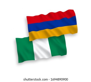 National vector fabric wave flags of Armenia and Nigeria isolated on white background. 1 to 2 proportion.