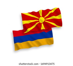 National vector fabric wave flags of Armenia and North Macedonia isolated on white background. 1 to 2 proportion.