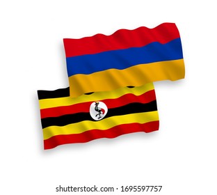 National vector fabric wave flags of Armenia and Uganda isolated on white background. 1 to 2 proportion.