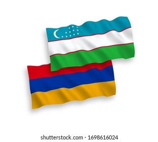 National vector fabric wave flags of Armenia and Uzbekistan isolated on white background. 1 to 2 proportion.