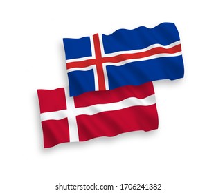 Banderas nacionales de ondulación de tela vectorial de Dinamarca e Islandia aisladas en fondo blanco. 1 a 2 proporciones.