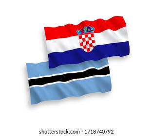 National vector fabric wave flags of Botswana and Croatia isolated on white background. 1 to 2 proportion.