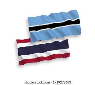Banderas de olas de tela vectorial nacional de Botswana y Tailandia aisladas en fondo blanco. 1 a 2 proporciones.