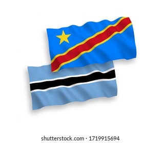 National vector fabric wave flags of Botswana and Democratic Republic of the Congo isolated on white background. 1 to 2 proportion.