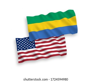 National vector fabric wave flags of Gabon and USA isolated on white background. 1 to 2 proportion.