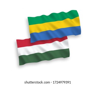 National vector fabric wave flags of Gabon and Hungary isolated on white background. 1 to 2 proportion.