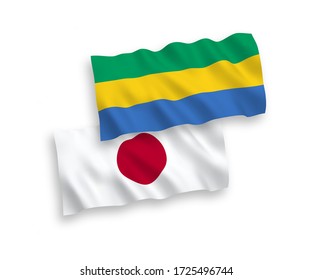 Banderas de ondulación de tela vectorial nacional de Japón y Gabón aisladas en fondo blanco. de 1 a 2.