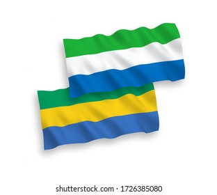 National vector fabric wave flags of Gabon and Sierra Leone isolated on white background. 1 to 2 proportion.