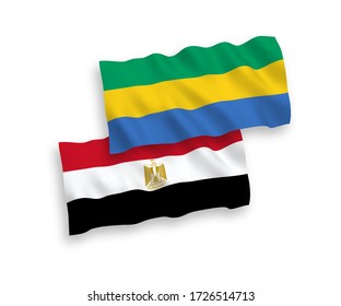 Banderas de ondulación de tela vectorial nacional de Gabón y Egipto aisladas en fondo blanco. de 1 a 2.