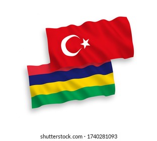 National vector fabric wave flags of Turkey and Mauritius isolated on white background. 1 to 2 proportion.