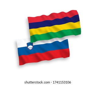 National vector fabric wave flags of Slovenia and Mauritius isolated on white background. 1 to 2 proportion.