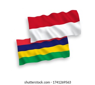 National vector fabric wave flags of Indonesia and Mauritius isolated on white background. 1 to 2 proportion.
