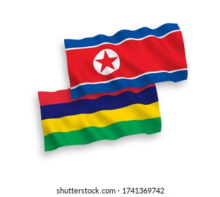 National vector fabric wave flags of North Korea and Mauritius isolated on white background. 1 to 2 proportion.
