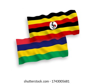 National vector fabric wave flags of Mauritius and Uganda isolated on white background. 1 to 2 proportion.