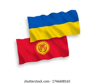 National vector fabric wave flags of Kyrgyzstan and Ukraine isolated on white background. 1 to 2 proportion.
