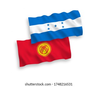 National vector fabric wave flags of Kyrgyzstan and Honduras isolated on white background. 1 to 2 proportion.