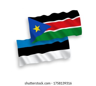 National vector fabric wave flags of Estonia and Republic of South Sudan isolated on white background. 1 to 2 proportion.