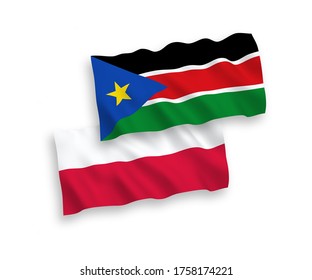 National vector fabric wave flags of Republic of South Sudan and Poland isolated on white background. 1 to 2 proportion.