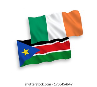 National vector fabric wave flags of Ireland and Republic of South Sudan isolated on white background. 1 to 2 proportion.