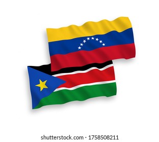 National vector fabric wave flags of Venezuela and Republic of South Sudan isolated on white background. 1 to 2 proportion.