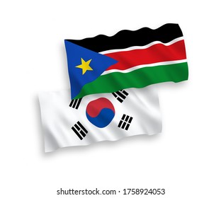 Banderas de olas de tela vectorial nacional de Corea del Sur y la República de Sudán del Sur aisladas en fondo blanco. de 1 a 2.
