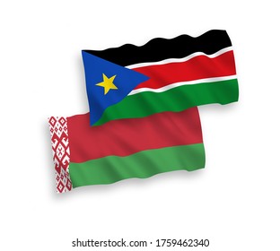 National vector fabric wave flags of Republic of South Sudan and Belarus isolated on white background. 1 to 2 proportion.