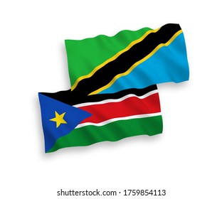National vector fabric wave flags of Republic of South Sudan and Tanzania isolated on white background. 1 to 2 proportion.
